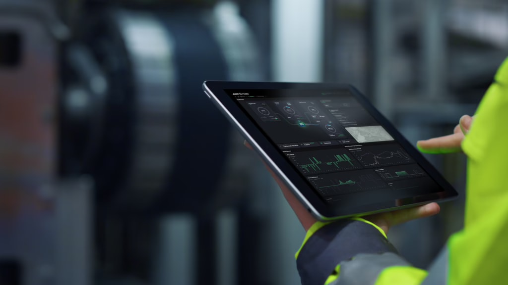 AvantPower OptiGrid dashboard on tablet in industrial setting